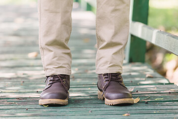 Model wearing yellow brown  color cargo pants or cargo trousers