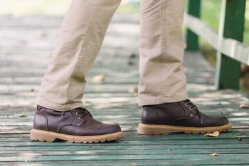Model wearing yellow brown  color cargo pants or cargo trousers