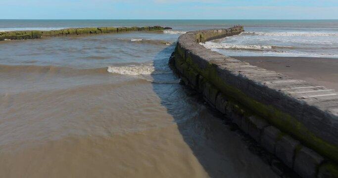 Aerial: Coastline and harbour pier, Patea, Taranaki, New Zealand