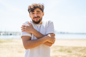 Handsome Arab man at outdoors freezing