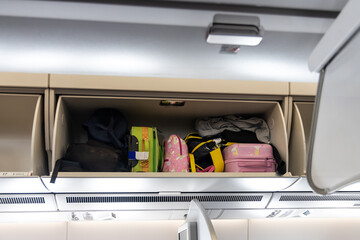 Overhead storage for bags and luggages on airplane cabin