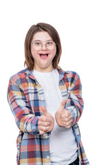 Shocked teen girl with Downs syndrom shows thumbs up gesture. Isolated on white background