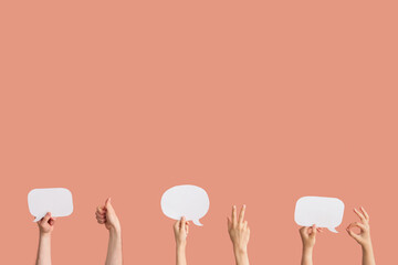 Different hands with speech bubbles on red background
