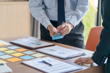 Business People brainstorming Meeting Design Ideas use post it notes to share idea professional...