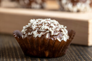 Chocolate candies with coconut flavor and filling