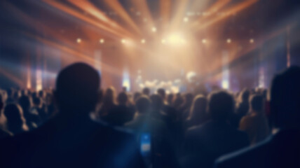 People at an award ceremony standing together on stage at a blurred event