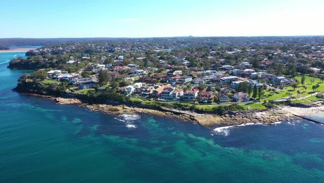 Aerial drone view of Cronulla South along Oak Park Beach and Rock Pool in the Sutherland Shire, South Sydney, NSW Australia on a sunny day in July 2023  