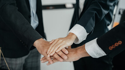 Team workers, men and women, join hands to join forces to join forces to work for the industry for success. Teamwork and professional colleagues : Workers' hands, teamwork concept.