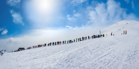 People queuing for the chairlift leading to the top of the ski resort (Niseko, Hokkaido, Japan)