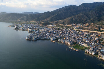 Village and lake in Shuanglang, Yunnan, China.