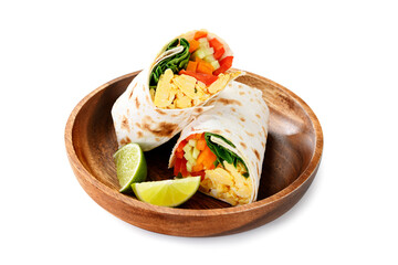 Homemade breakfast egg burrito with fresh vegetables and different sauces for healthy vegetarian breakfast.