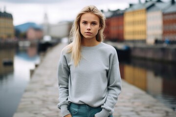 Swedish teenage girl, wearing modern outfit, standing in Stockholm  - obrazy, fototapety, plakaty