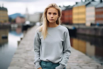 Tuinposter Swedish teenage girl, wearing modern outfit, standing in Stockholm  © Florian