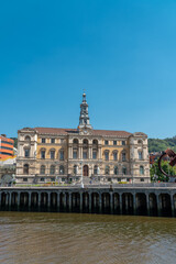 Naklejka premium Beautiful City Hall building of the Bilbao city, built in Baroque style. In front of the building is the river Nervion. Travel destination in North of Spain