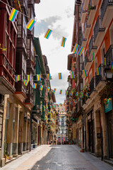 Beautiful streets of European city Bilbao. Important travel destination in North of Spain. View of historic center. Street decorated with LGBT flag. 
