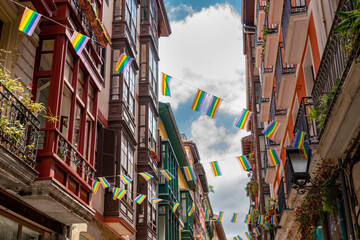Beautiful streets of European city Bilbao. Situated in North of Span is the largest city in Basque Country and important travel destination. View of historic center. Street decorated with LGBT flag
