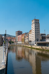 Promenade area of the River Nervion. In background the old city of Bilbao in front plane the river Nervion. Travel destination in North of Spain, Basque Country