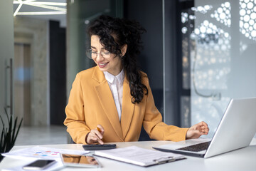 Mature successful financier accountant on paper work with papers, documents contracts and charts...