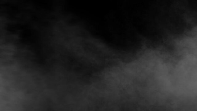 white smoke, steam blowing horizontally on a black background. 