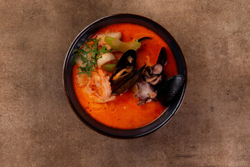 Tom yum. Traditional soup with seafood.