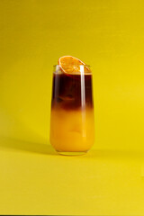 Layered cocktail in a tall glass.