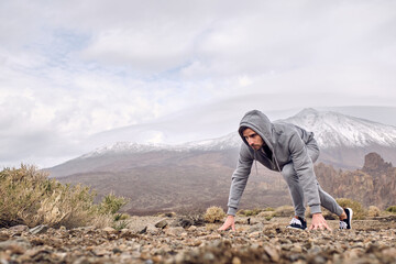 Man getting ready for running in mountains