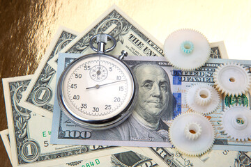 mechanical stopwatch on the background of dollars. Part time accuracy for business. business and finance time.