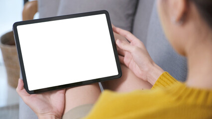 Woman hand using digital tablet with blank screen for mock up, template, people technology and lifestyle
