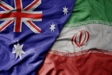 big waving realistic national colorful flag of australia and national flag of iran . © luzitanija
