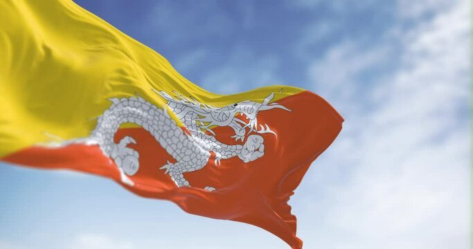National flag of Bhutan waving in the wind on a clear day