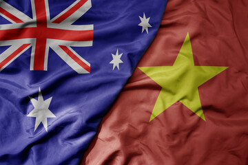 big waving realistic national colorful flag of australia and national flag of vietnam .