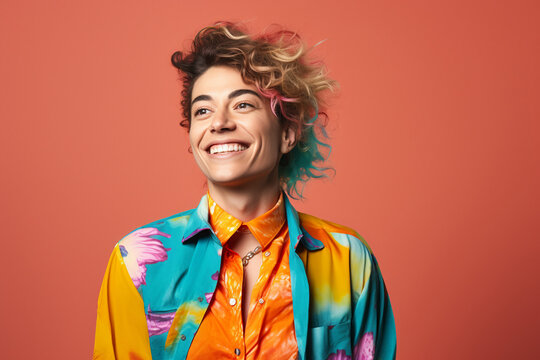 non binary person wearing colorful clothes studio portrait