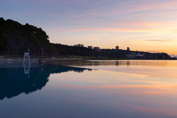 The Samuel-de-Champlain Boulevard new Beach Station with its wading pool next to the St. Lawrence River seen at sunrise in summer, Quebec City, Quebec, Canada