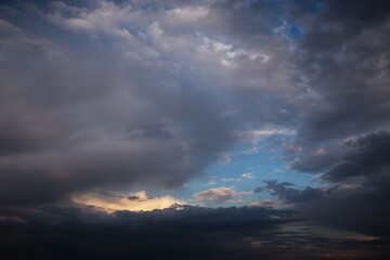 Storm cloudy dramatic sky with dark rain grey cumulus cloud and blue sky background texture, thunderstorm, heaven