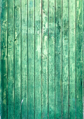 Fototapeta na wymiar Green painted distressed and vintage wooden surface