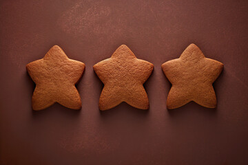 Top view of traditional gingerbread cookies. Trendy minimalist winter Christmas banner.