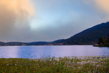 View of Abant Lake (Abant Golu). Landscape of an mountain lake in front of mountain range. Glorious lake landscape. The collaboration of blue and green. Multiple colors and amazing lake scenery.