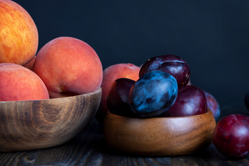 Ripe plums on the table in the kitchen