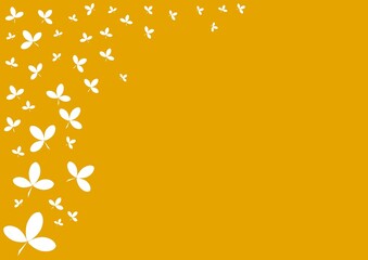 Abstract orange background with leaves. Flying ivy leaves on the orange background.