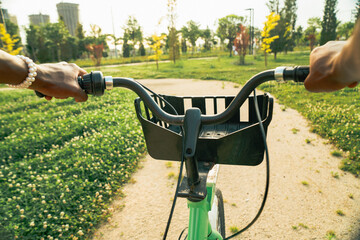 Fototapeta na wymiar POV bicycle: tourist in park