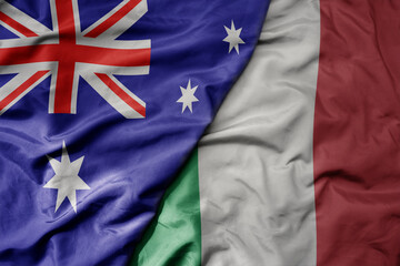 big waving realistic national colorful flag of australia and national flag of italy .