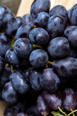 Ripe fresh grapes on a board
