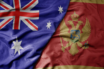 big waving realistic national colorful flag of australia and national flag of montenegro .