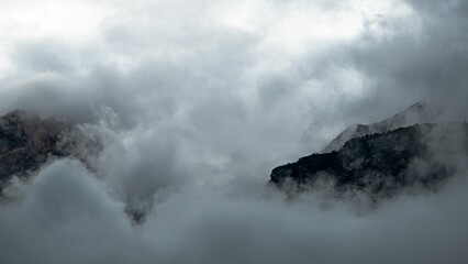 Mountains rising from the clouds. Dolomites, Italy