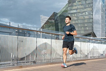 Active lifestyle and motivation. Runs alone on a treadmill in the city uses a fitness watch. A...