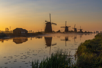 Fototapeta na wymiar Traditional Dutch windmills in Kinderdijk - Unesco site, The Netherlands