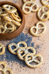 Poppy seed coating dried bagels on the table