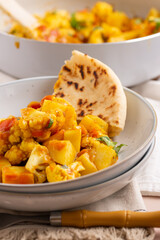 Delicious Aloo Gobi Masala on a Plate: Authentic Indian Spicy Potato Cauliflower Curry with Exotic Spices and Nutritious Vegetables