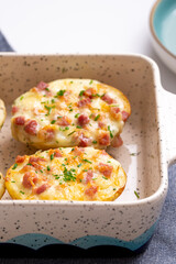 Cheesy Homemade Baked Potatoes: Irresistible Comfort Food with Melted Cheddar Cheese and Creamy Sauce, Perfectly Baked to Golden Brown Perfection