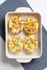 Cheesy Homemade Baked Potatoes: Irresistible Comfort Food with Melted Cheddar Cheese and Creamy Sauce, Perfectly Baked to Golden Brown Perfection